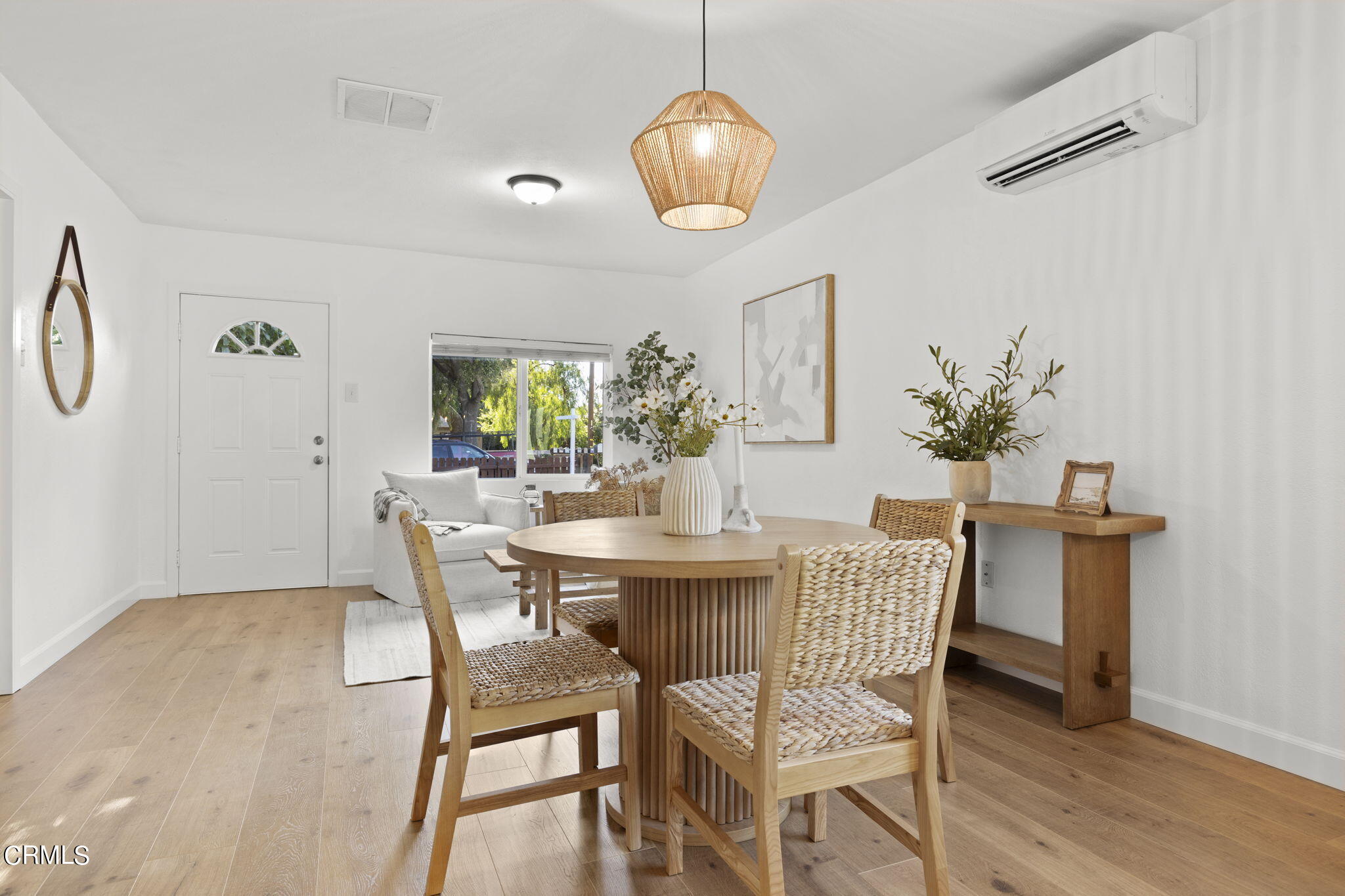 370 Prospect Street Oak View, CA 93022 - Photo 8 of 46 a dining room with furniture potted plants and wooden floor