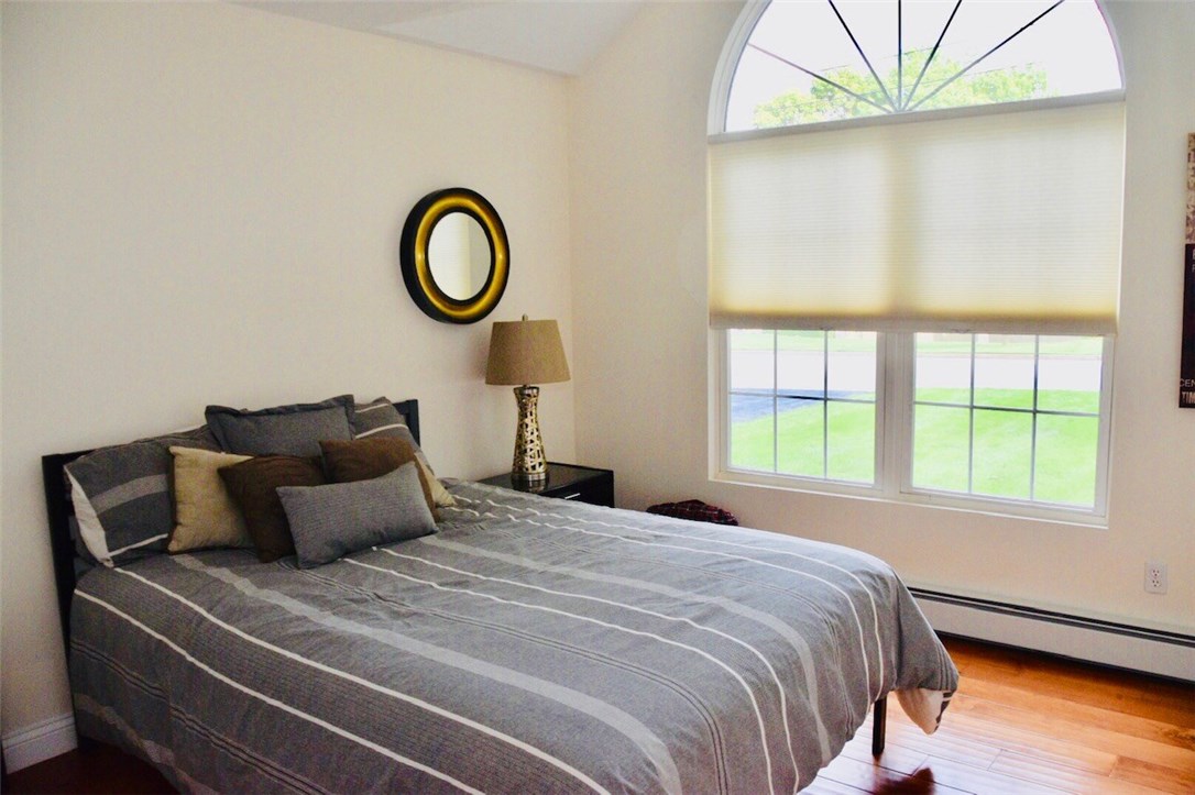 101 Sundale Road Cranston, RI 02921 - Photo 10 of 24 The first of three bedrooms. Baseboard heat provides maximum space. A stylish, decorative window provides tons of natural light.