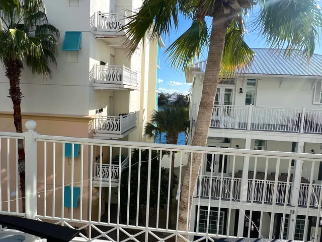 a view of a house with a palm tree