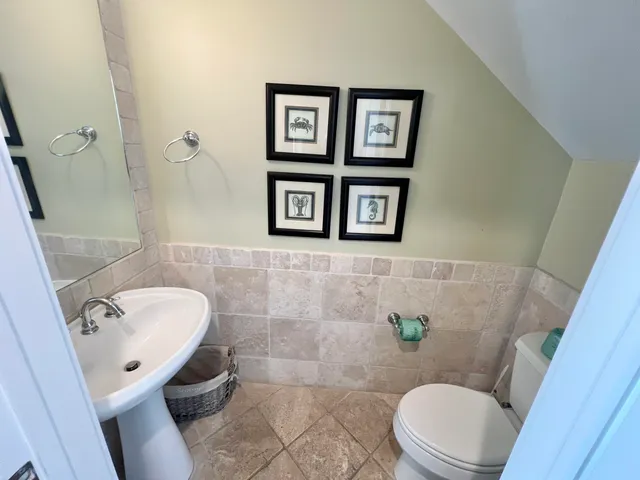 a bathroom with a toilet and a sink