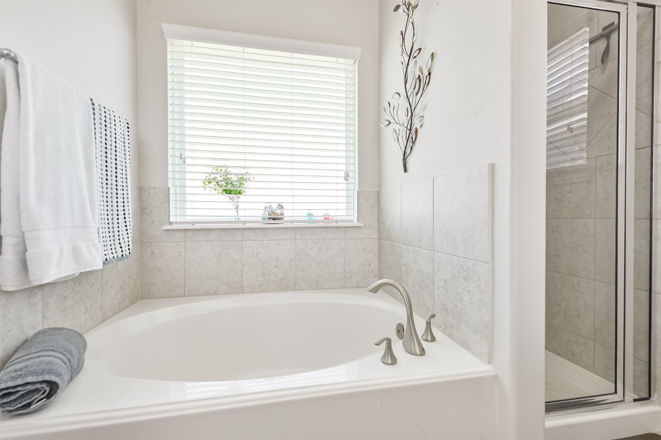 7527 Windsor Valley Lane Houston, TX 77049 - Photo 25 of 35 a white bath tub sitting next to a window