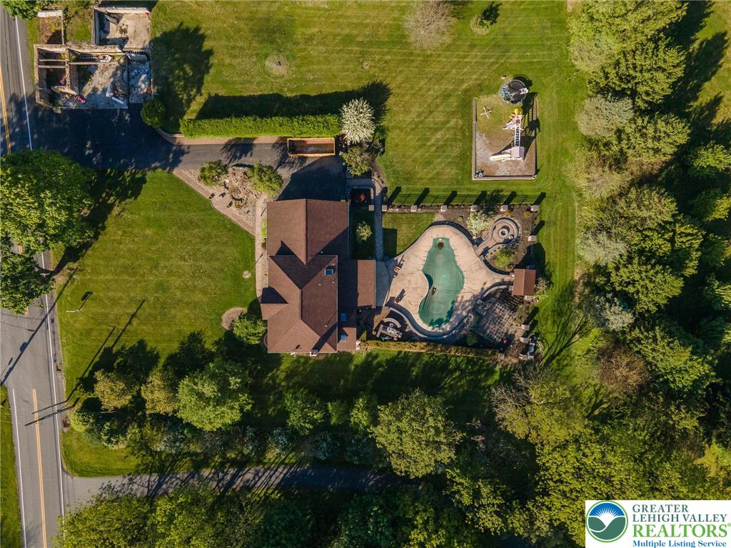 2170 Clearview Road Coplay, PA 18037 - Photo 7 of 75 An aerial view showcases a residential property with a vast lawn and recreational amenities.