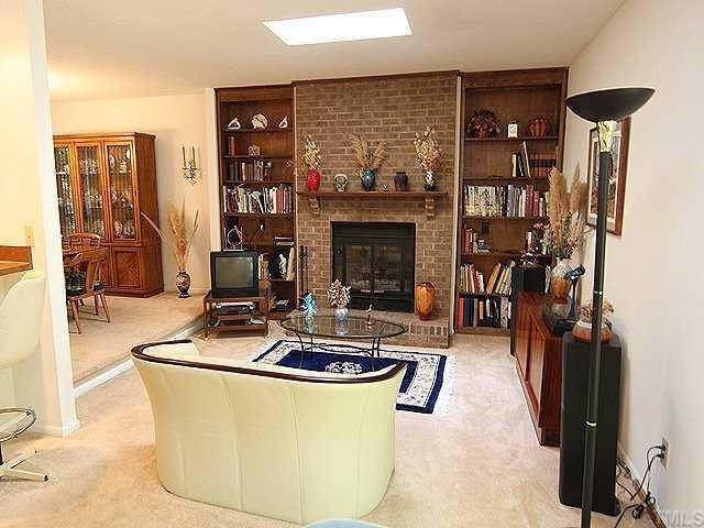 3912 King Charles Road Durham, NC 27707 - Photo 7 of 12 Another view of the living room with masonry fireplace. Den/Family/Great Room