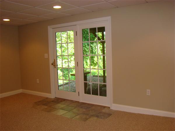 5 Gray Road Andover, MA 01810 - Photo 17 of 22 a view of an empty room with wooden floor and a window