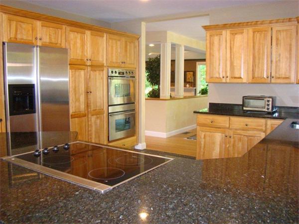 5 Gray Road Andover, MA 01810 - Photo 4 of 22 a kitchen with stainless steel appliances granite countertop a sink and a refrigerator