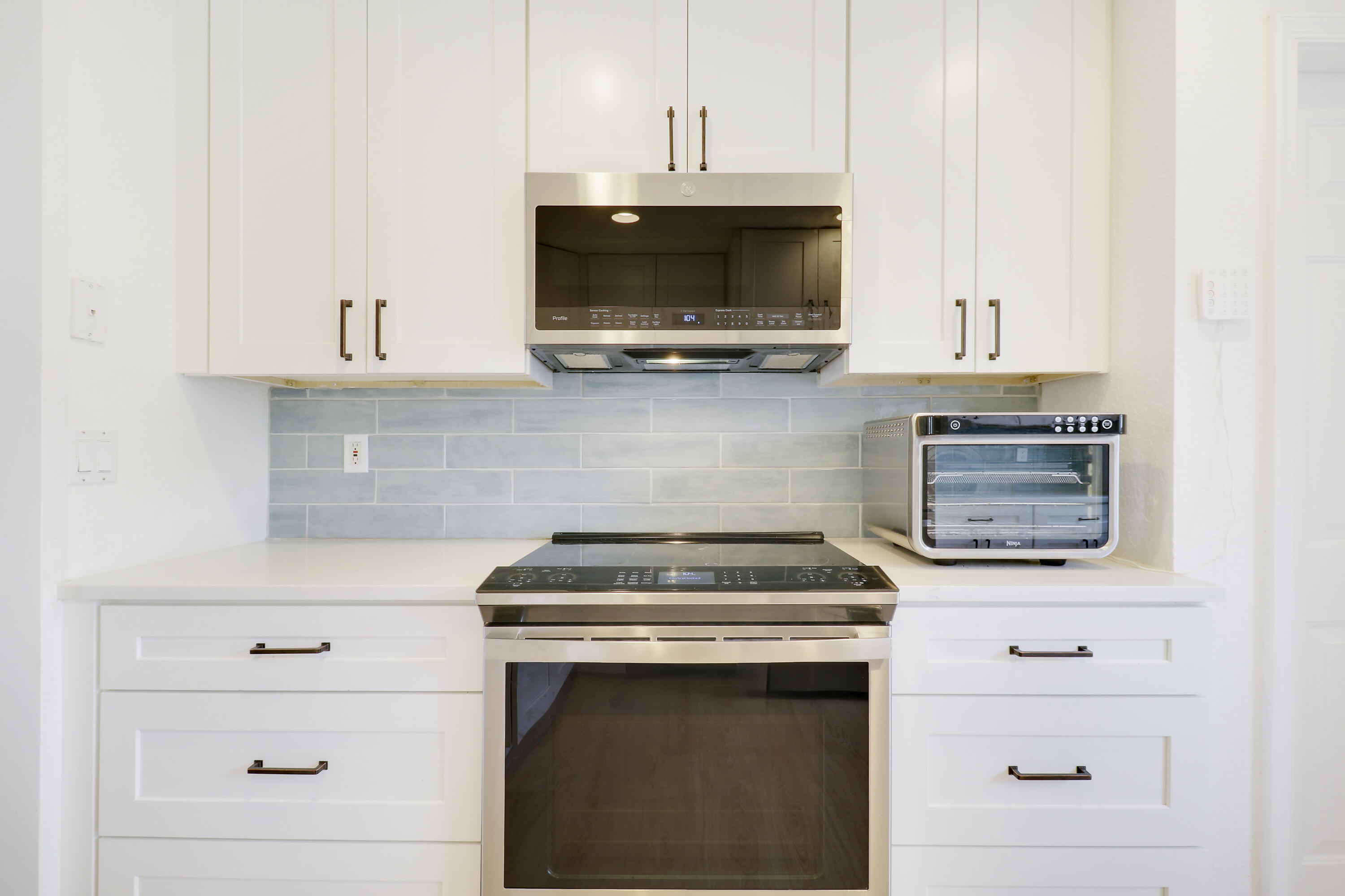 144 Pennock Landing Circle Jupiter, FL 33458 - Photo 13 of 34 a stove top oven sitting inside of a kitchen