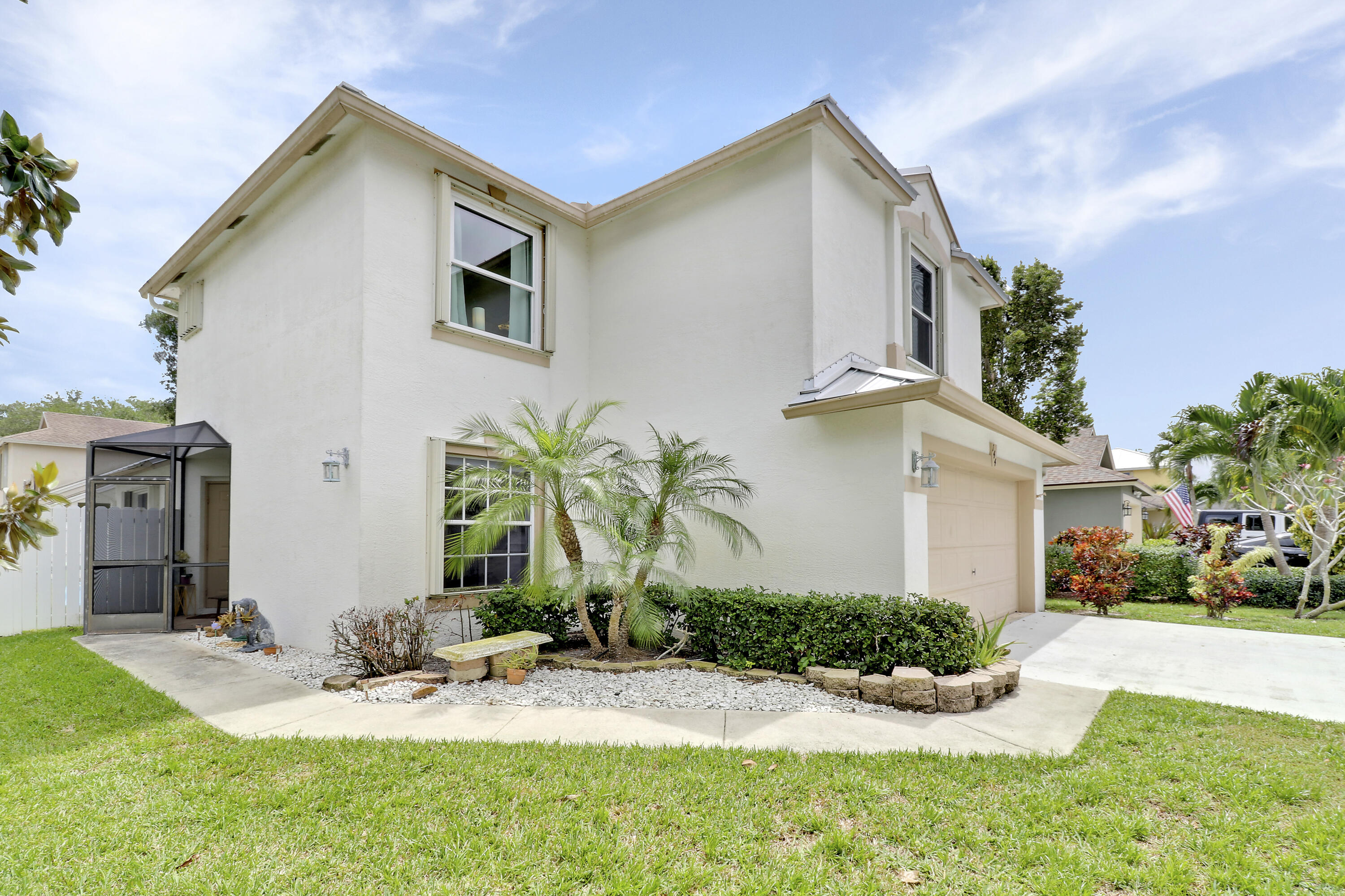144 Pennock Landing Circle Jupiter, FL 33458 - Photo 17 of 34 a front view of house with yard