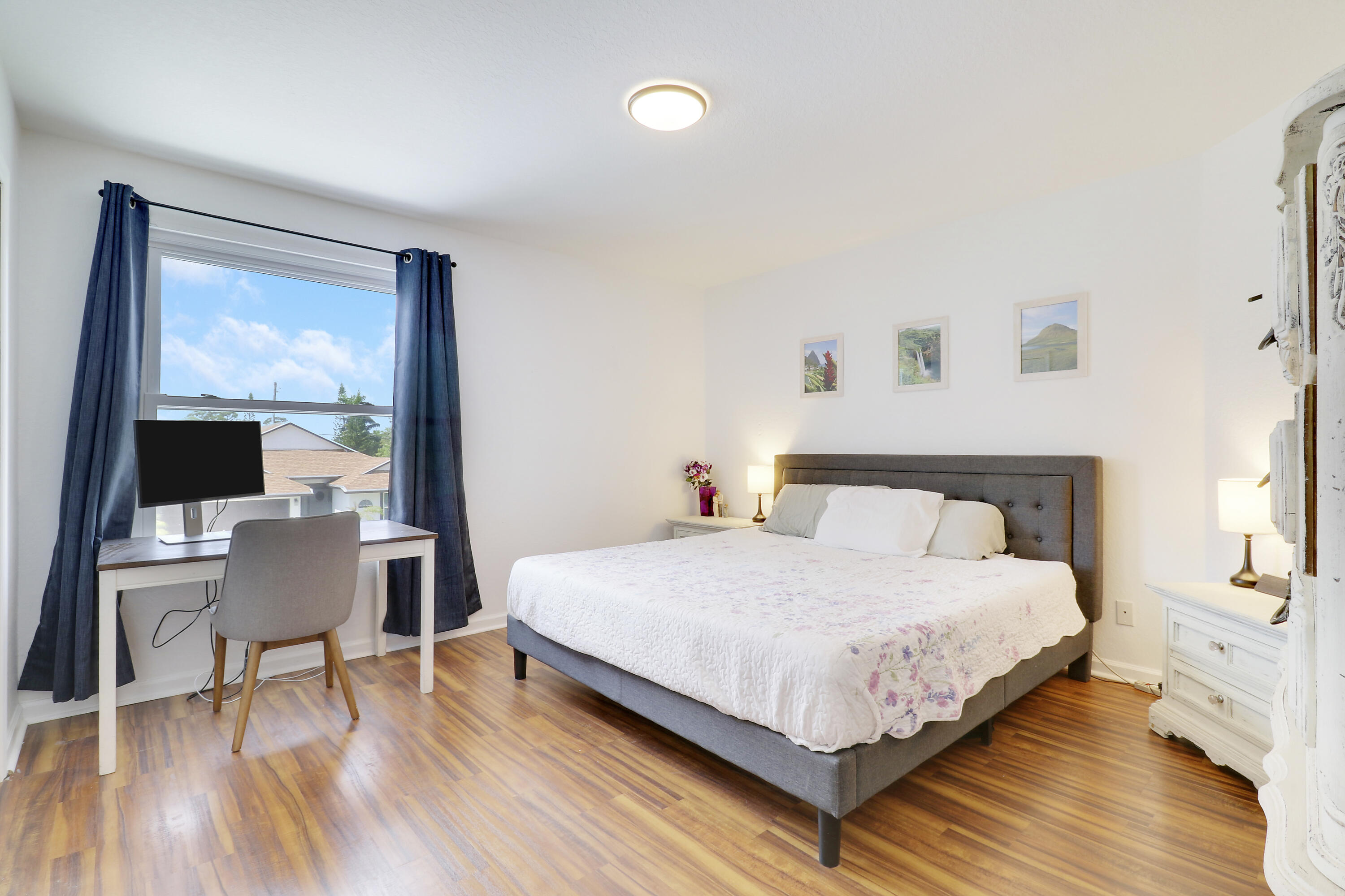 144 Pennock Landing Circle Jupiter, FL 33458 - Photo 18 of 34 a bedroom with a bed and a desk