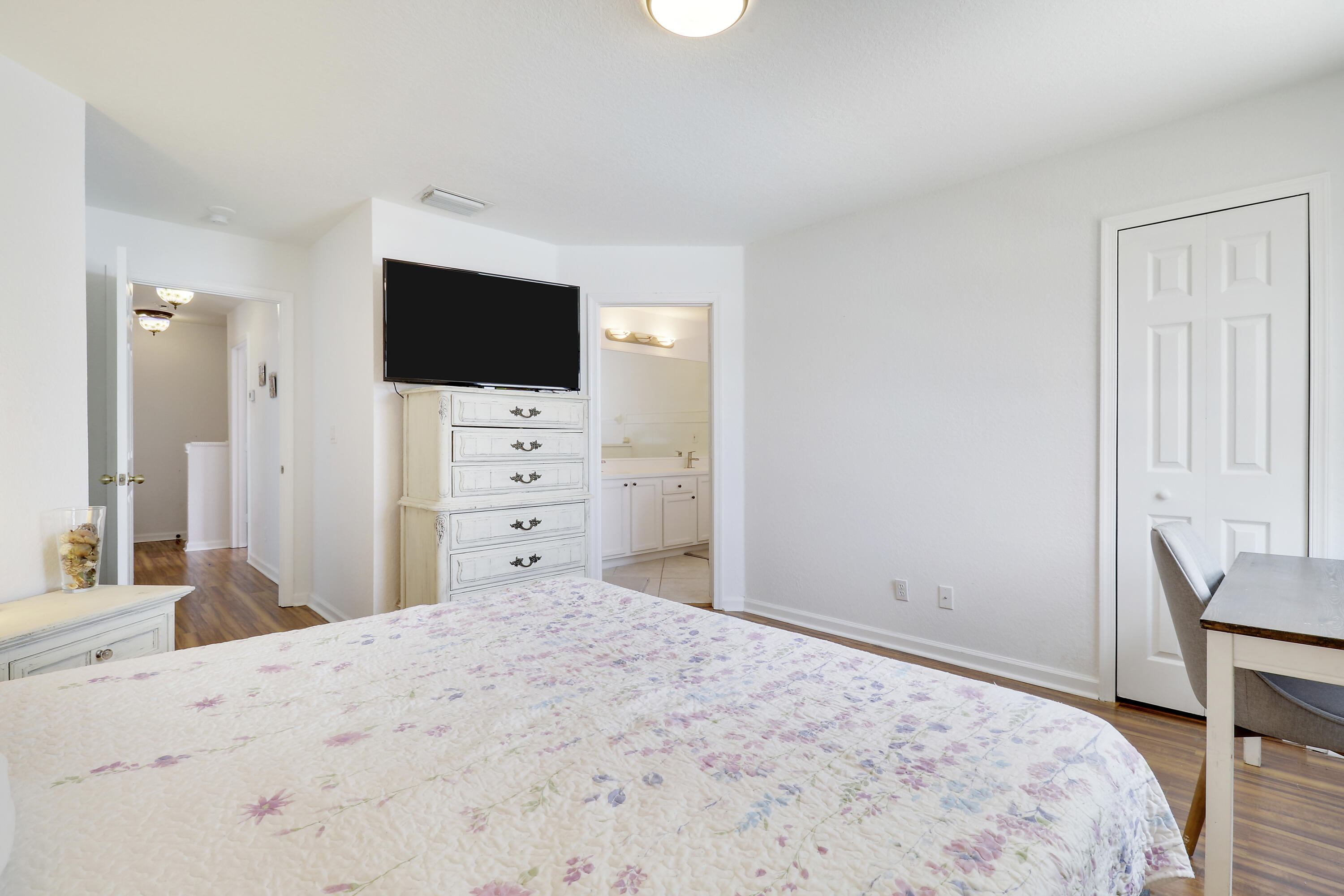 144 Pennock Landing Circle Jupiter, FL 33458 - Photo 19 of 34 a bedroom with a bed and a flat screen tv