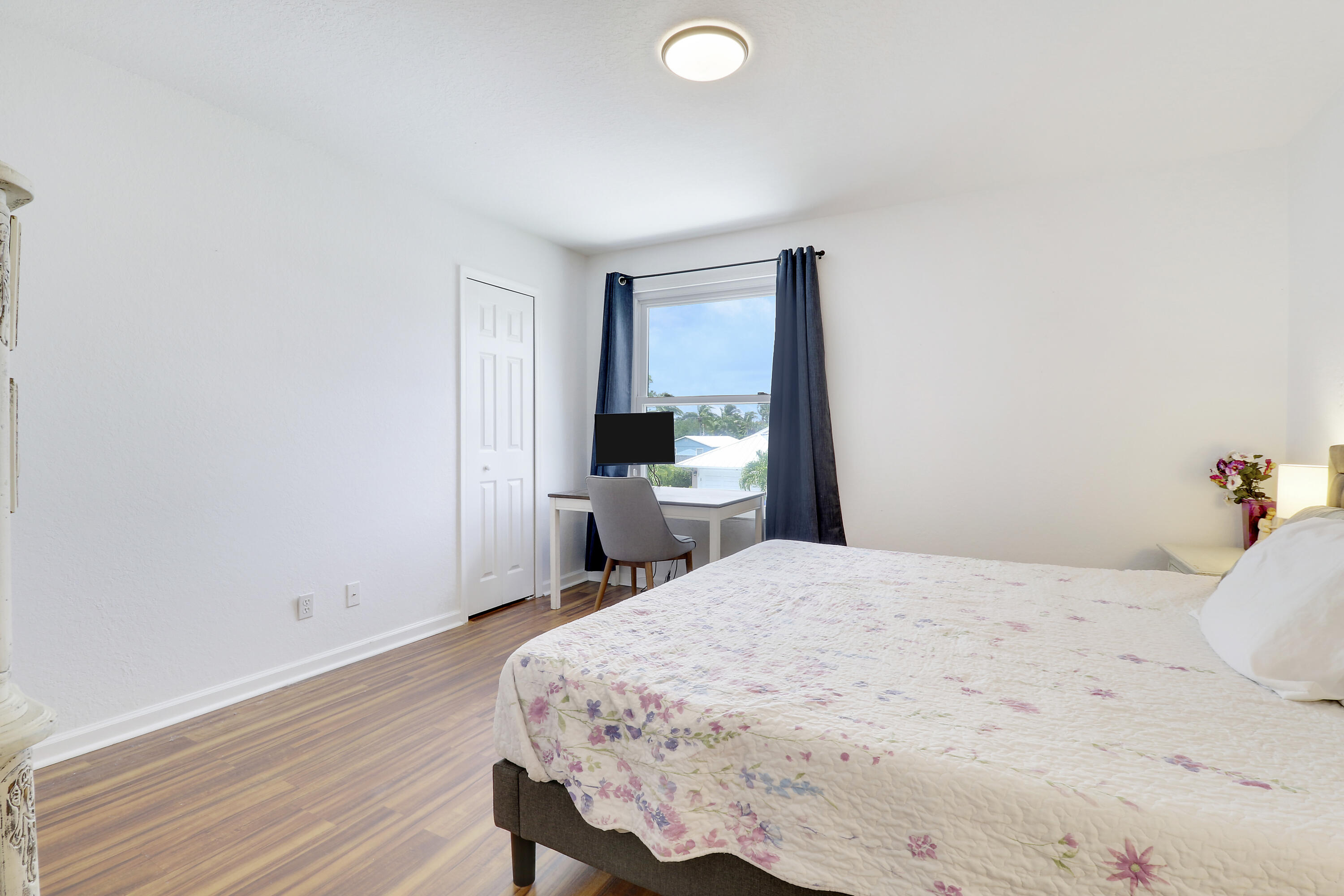 144 Pennock Landing Circle Jupiter, FL 33458 - Photo 20 of 34 a bedroom with a bed and a desk