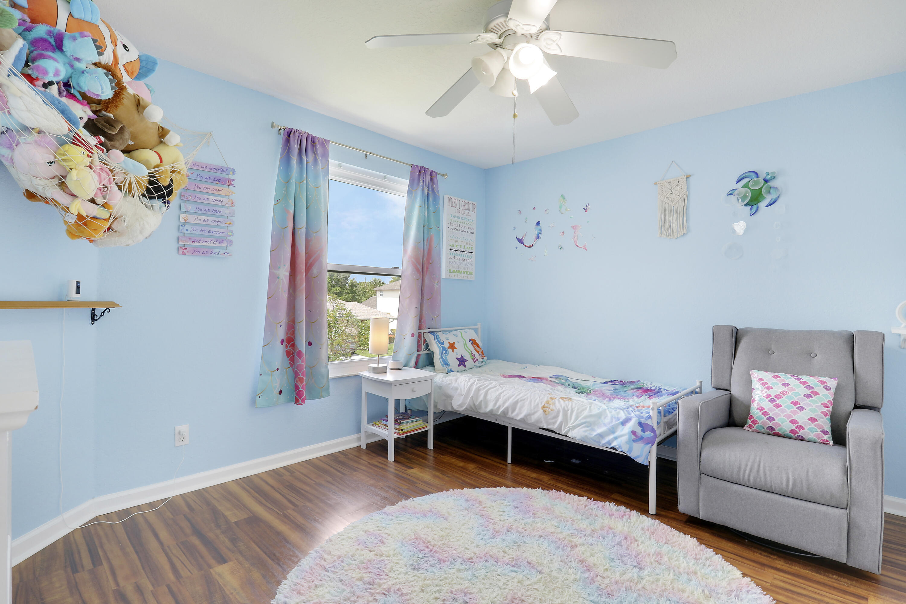 144 Pennock Landing Circle Jupiter, FL 33458 - Photo 25 of 34 a bedroom with furniture and a window