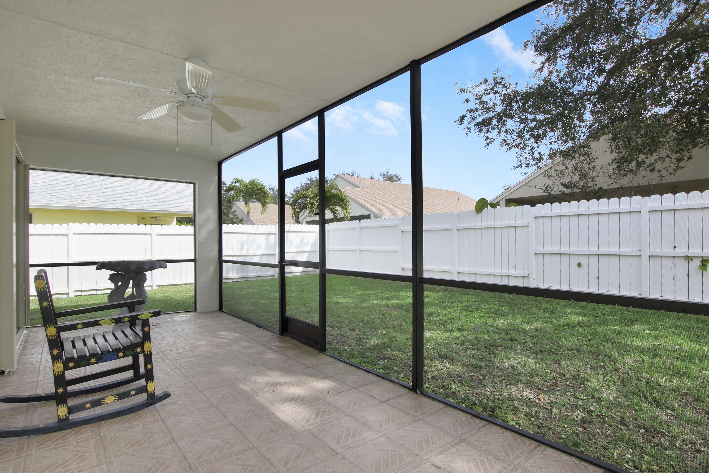 144 Pennock Landing Circle Jupiter, FL 33458 - Photo 30 of 34 a view of a porch with wooden floor and fence