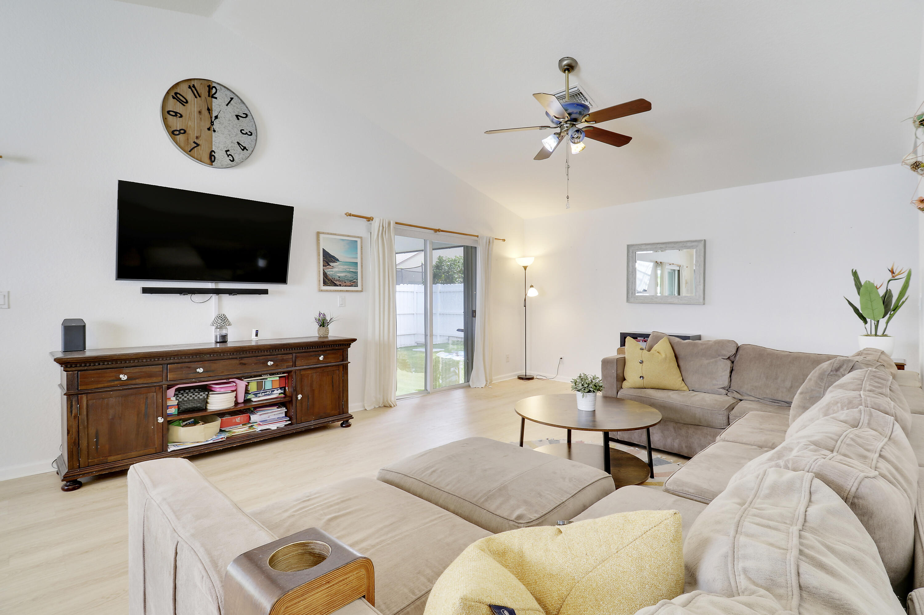 144 Pennock Landing Circle Jupiter, FL 33458 - Photo 8 of 34 a living room with furniture and a flat screen tv
