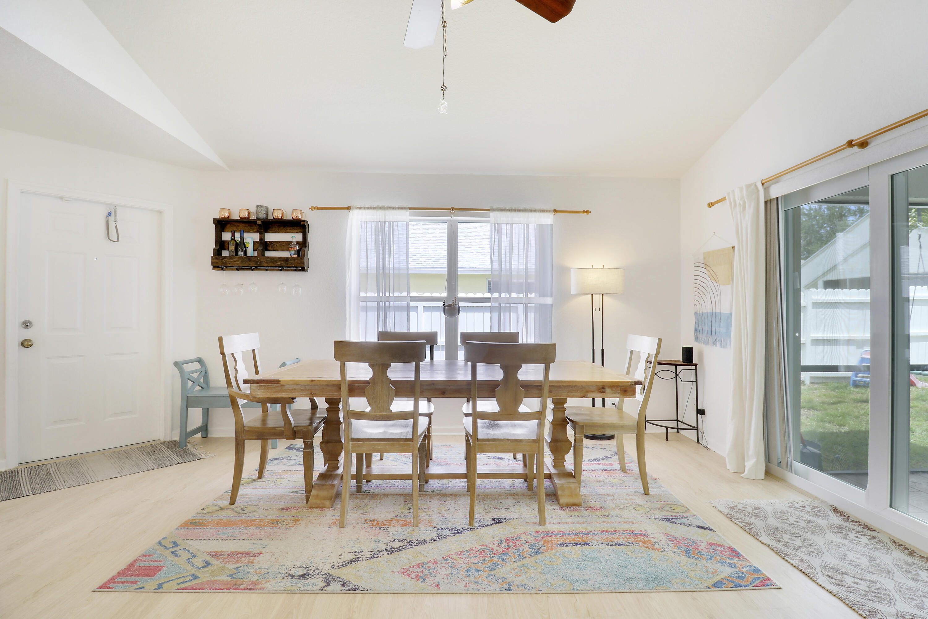144 Pennock Landing Circle Jupiter, FL 33458 - Photo 9 of 34 a view of a dining room with furniture and wooden floor