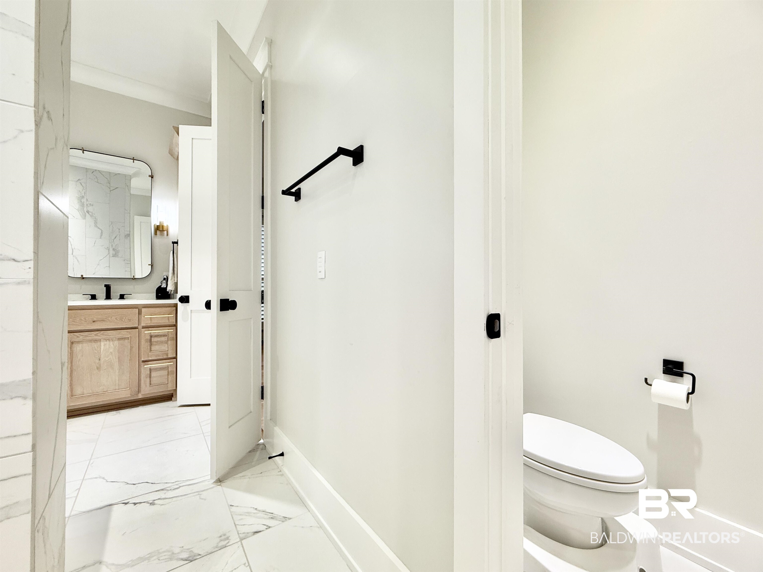 21767 Gallery Boulevard Fairhope, AL 36532 - Photo 35 of 74 Bathroom with marble look tiles and vanity
