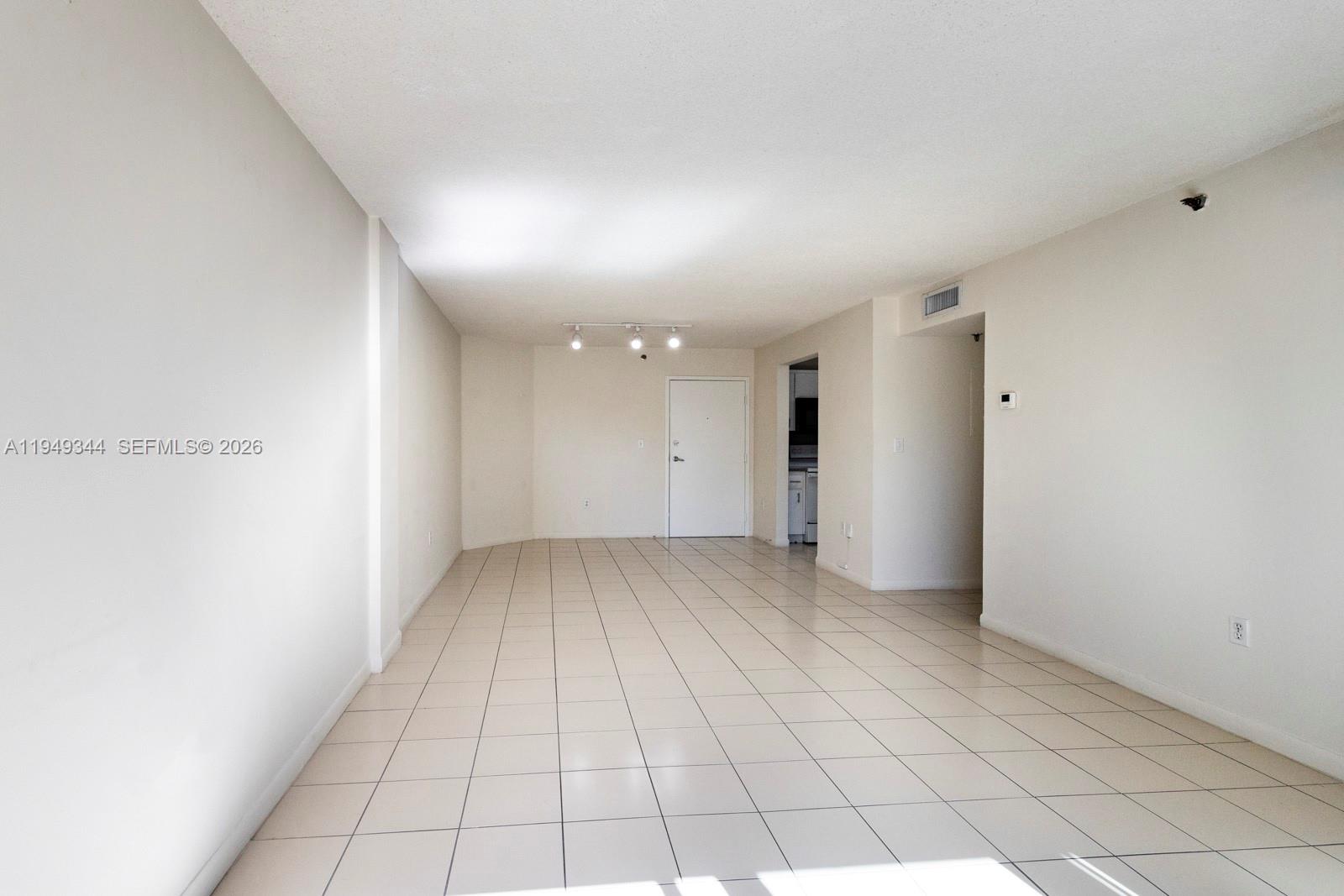 2660 Southwest 37th Avenue, Unit 314 Miami, FL 33133 - Photo 4 of 12 a view of an empty room and window