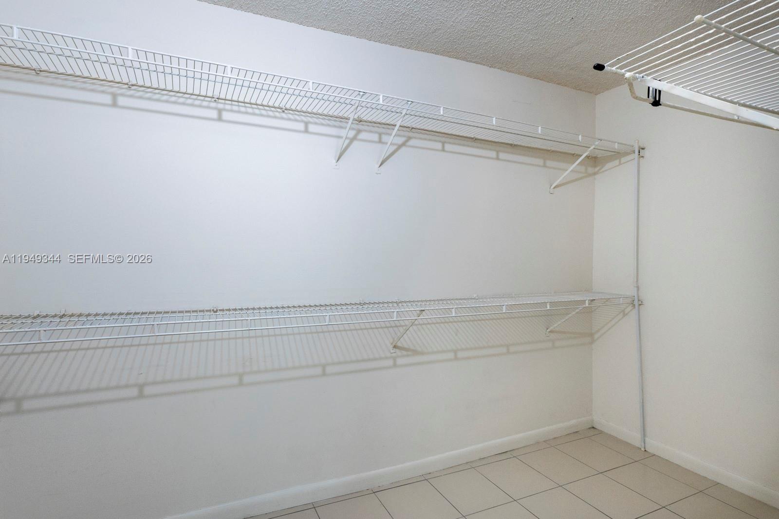 2660 Southwest 37th Avenue, Unit 314 Miami, FL 33133 - Photo 9 of 12 a view of a room with racks on the wall