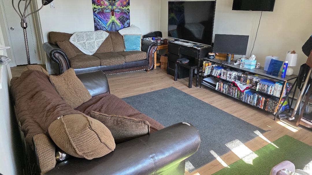 10 Arrowhead Drive, Unit 2 Algonquin, IL 60102 - Photo 6 of 8 a living room with furniture and a flat screen tv