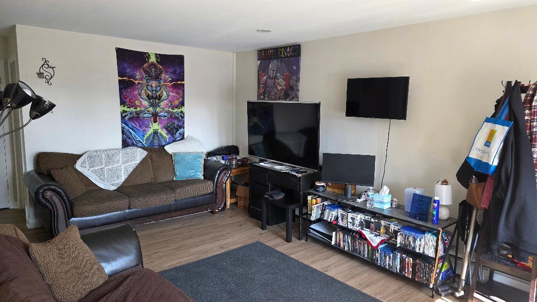 10 Arrowhead Drive, Unit 2 Algonquin, IL 60102 - Photo 8 of 8 a living room with furniture and a flat screen tv