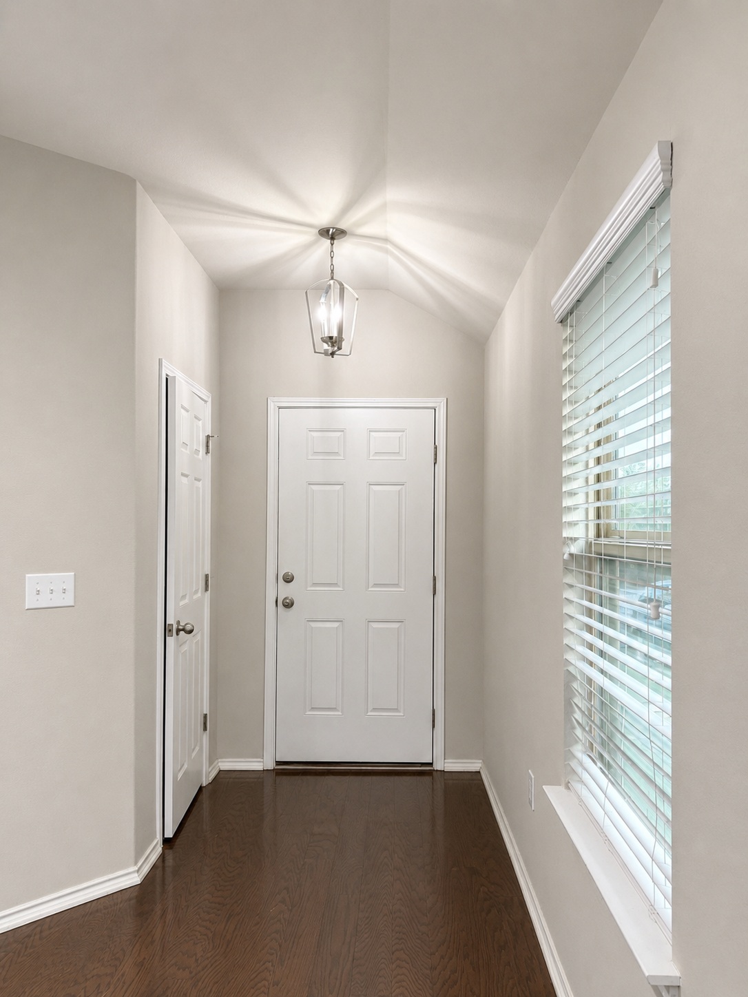 187 Limerick Road Buda, TX 78610 - Photo 2 of 18 A well-lit entry hall with polished wood flooring welcomes you inside this inviting home.