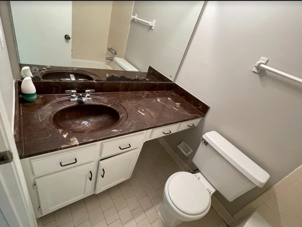 3878 Ross Road Memphis, TN 38115 - Photo 8 of 18 a bathroom with a toilet and a sink
