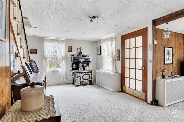 a livingroom with furniture and a window