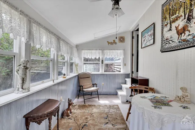 a room with furniture and a large window