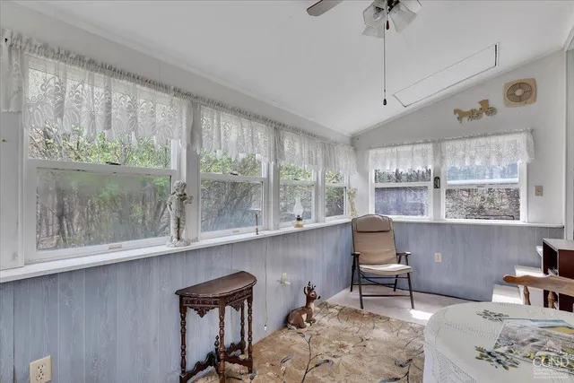 a bed room with a bed and window