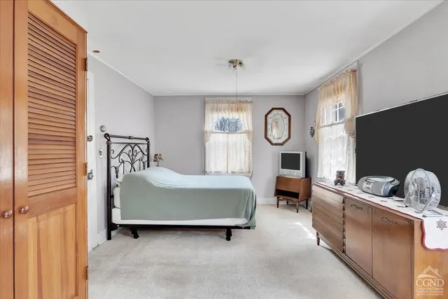 a room with furniture and flat screen tv