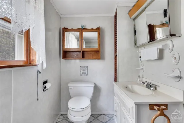 a view of a bathroom from a corridor