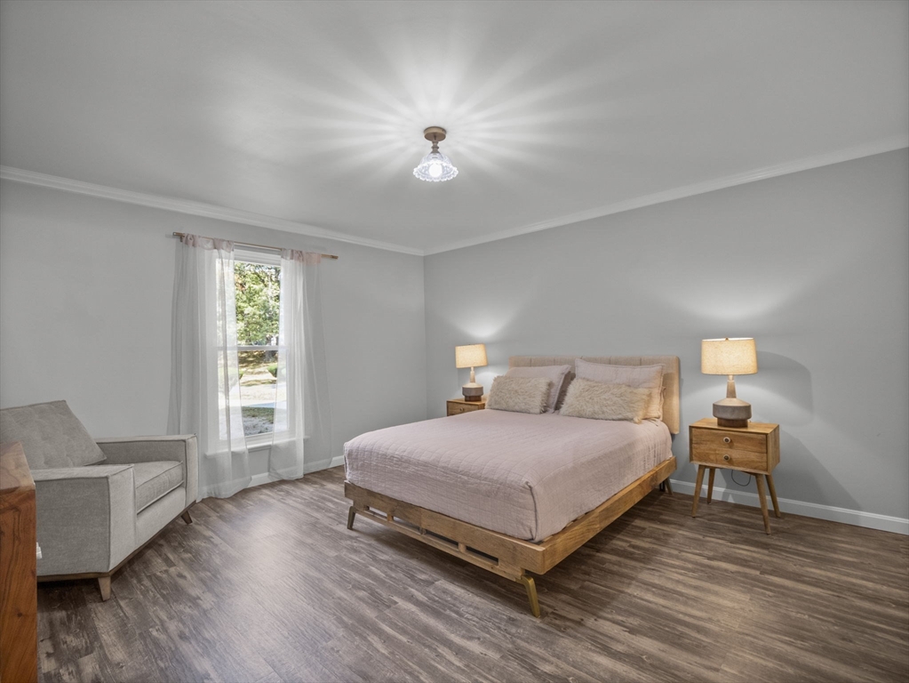 7 Shadowbrook Lane, Unit 9 Milford, MA 01757 - Photo 13 of 41 a bedroom with a bed and wooden floor