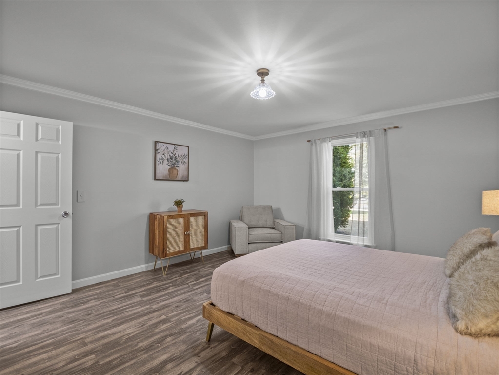 7 Shadowbrook Lane, Unit 9 Milford, MA 01757 - Photo 14 of 41 a bedroom with a bed and a table