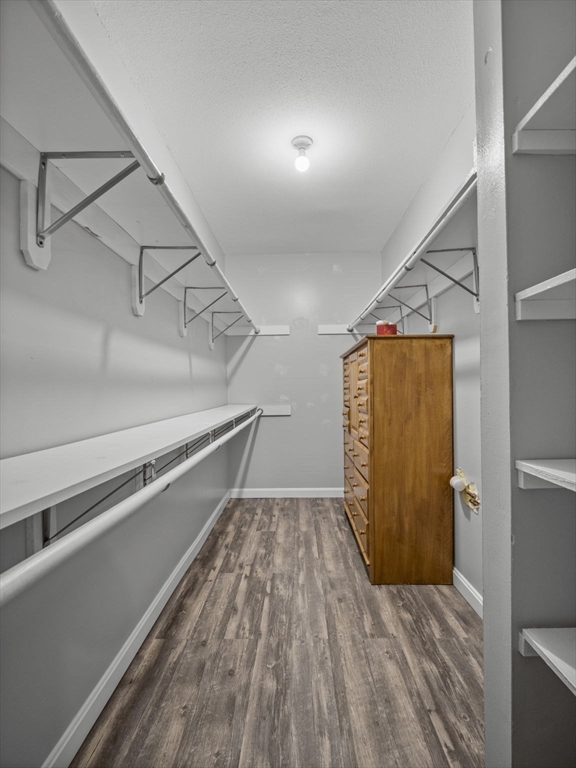 7 Shadowbrook Lane, Unit 9 Milford, MA 01757 - Photo 16 of 41 a view of a room with wooden floor and staircase