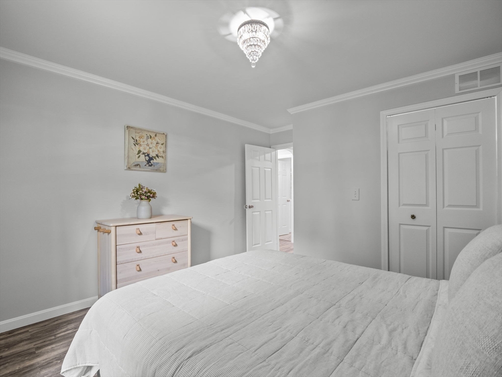 7 Shadowbrook Lane, Unit 9 Milford, MA 01757 - Photo 19 of 41 a bedroom with a bed and a window