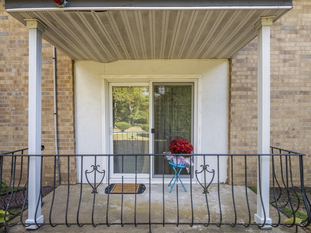 7 Shadowbrook Lane, Unit 9 Milford, MA 01757 - Photo 21 of 41 a front view of a house having outdoor seating