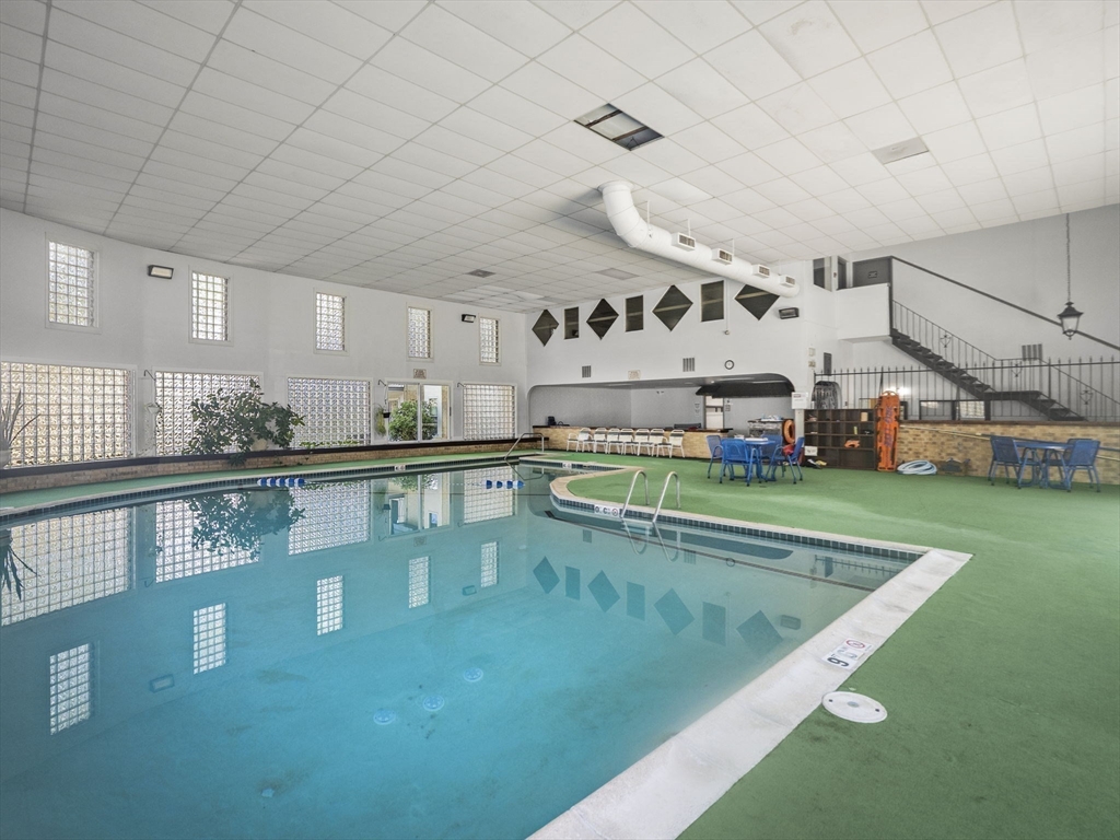 7 Shadowbrook Lane, Unit 9 Milford, MA 01757 - Photo 31 of 41 a view of a swimming pool and window