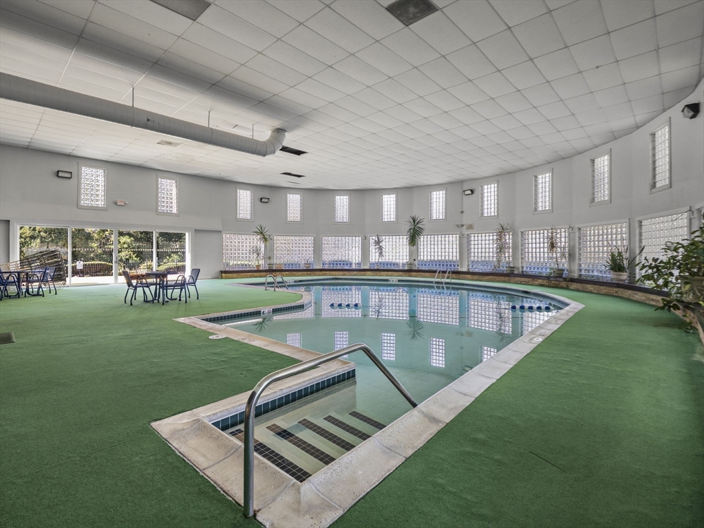 7 Shadowbrook Lane, Unit 9 Milford, MA 01757 - Photo 32 of 41 a view of a swimming pool and outdoor seating