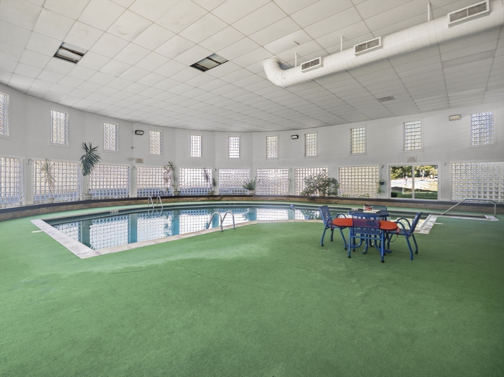 7 Shadowbrook Lane, Unit 9 Milford, MA 01757 - Photo 33 of 41 a living room with stainless steel appliances kitchen island granite countertop furniture and a kitchen view