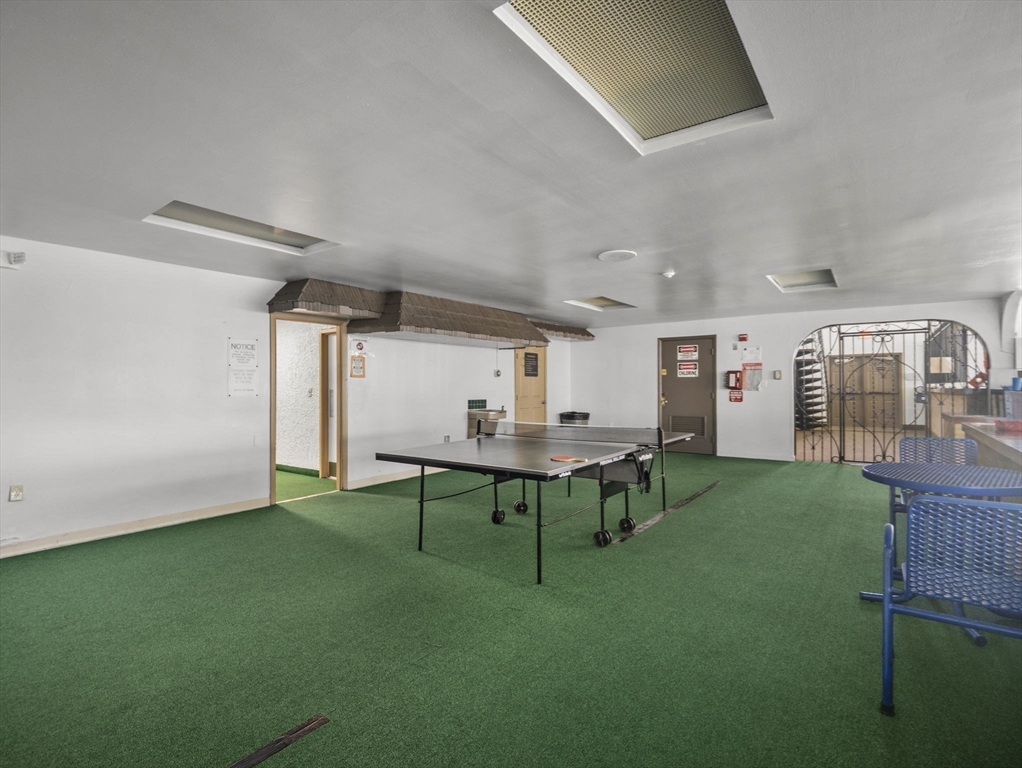 7 Shadowbrook Lane, Unit 9 Milford, MA 01757 - Photo 35 of 41 a view of a room that has a table and chairs in it