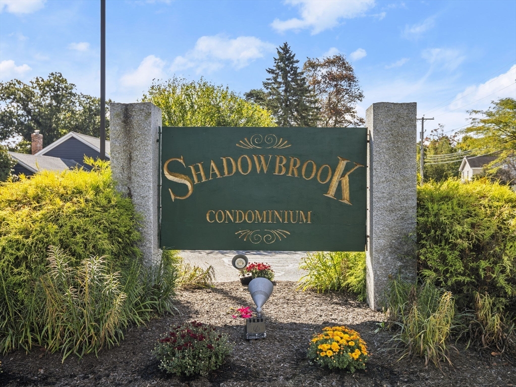 7 Shadowbrook Lane, Unit 9 Milford, MA 01757 - Photo 40 of 41 a sign that is on the side of the road