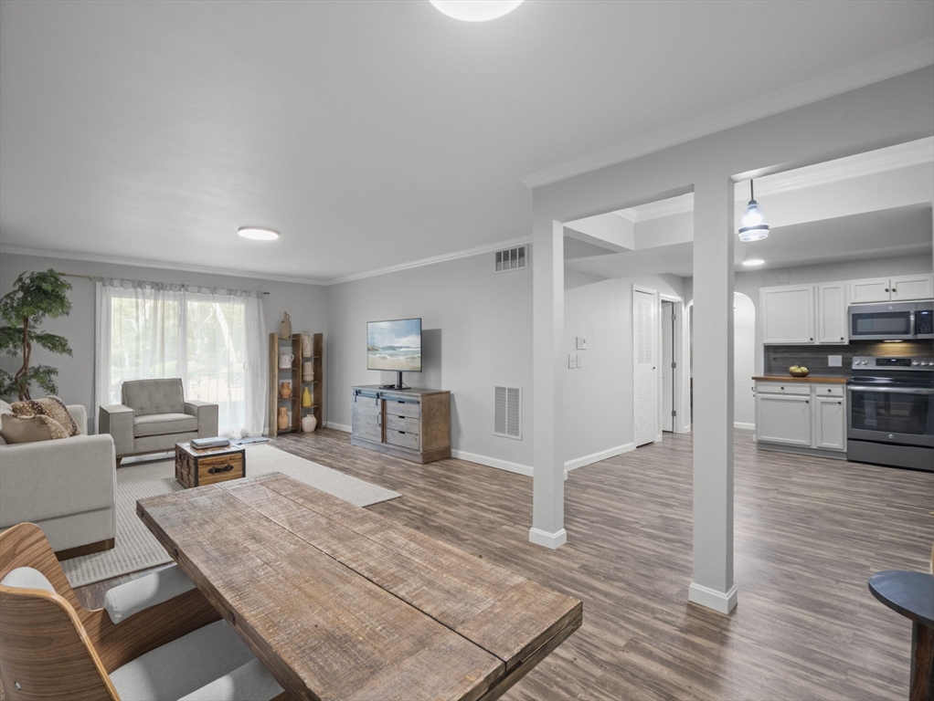7 Shadowbrook Lane, Unit 9 Milford, MA 01757 - Photo 6 of 41 a living room with furniture and kitchen view
