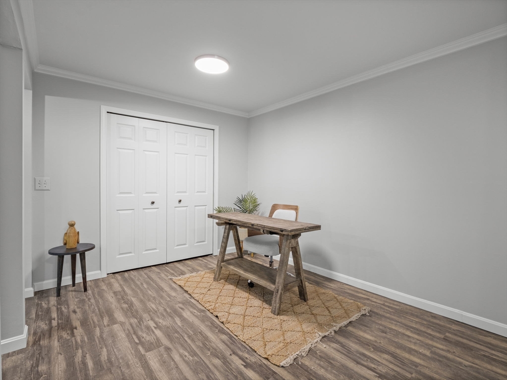 7 Shadowbrook Lane, Unit 9 Milford, MA 01757 - Photo 8 of 41 a workspace room with furniture and wooden floor