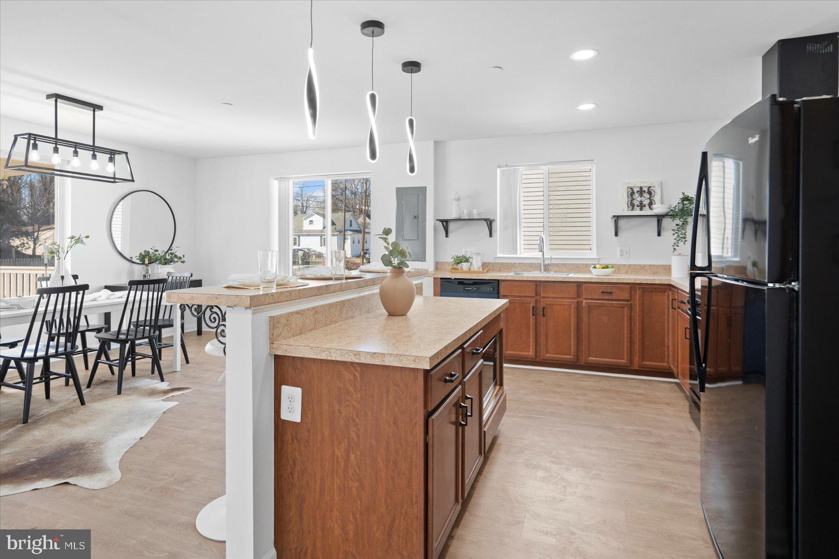 313 Homberg Avenue Baltimore, MD 21221 - Photo 14 of 47 a kitchen with stainless steel appliances granite countertop a sink a stove and a refrigerator