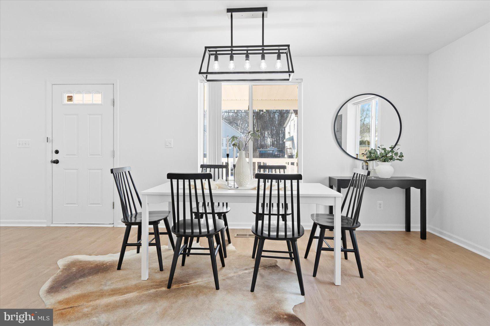 313 Homberg Avenue Baltimore, MD 21221 - Photo 18 of 47 a view of a dining room with furniture window and wooden floor