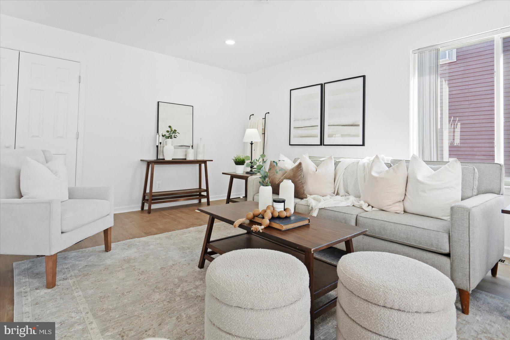 313 Homberg Avenue Baltimore, MD 21221 - Photo 21 of 47 a living room with furniture a rug and a large window