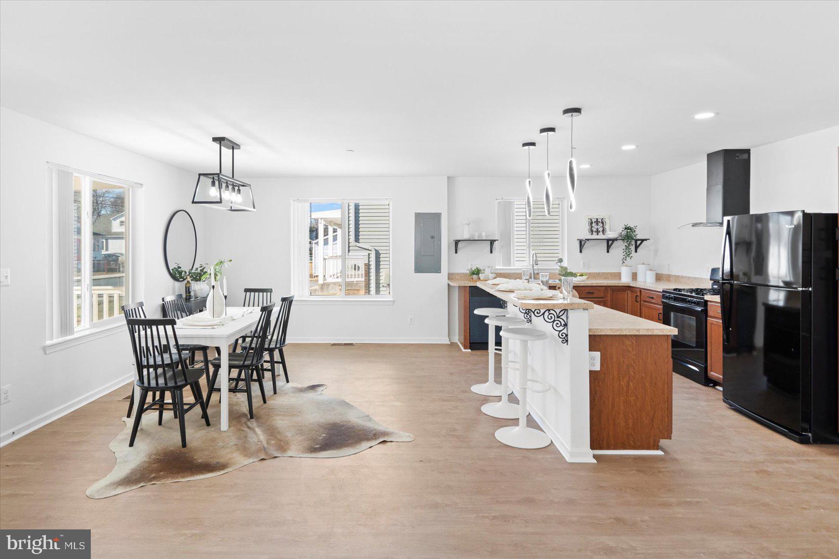 313 Homberg Avenue Baltimore, MD 21221 - Photo 23 of 47 a view of a dining room with furniture and a chandelier
