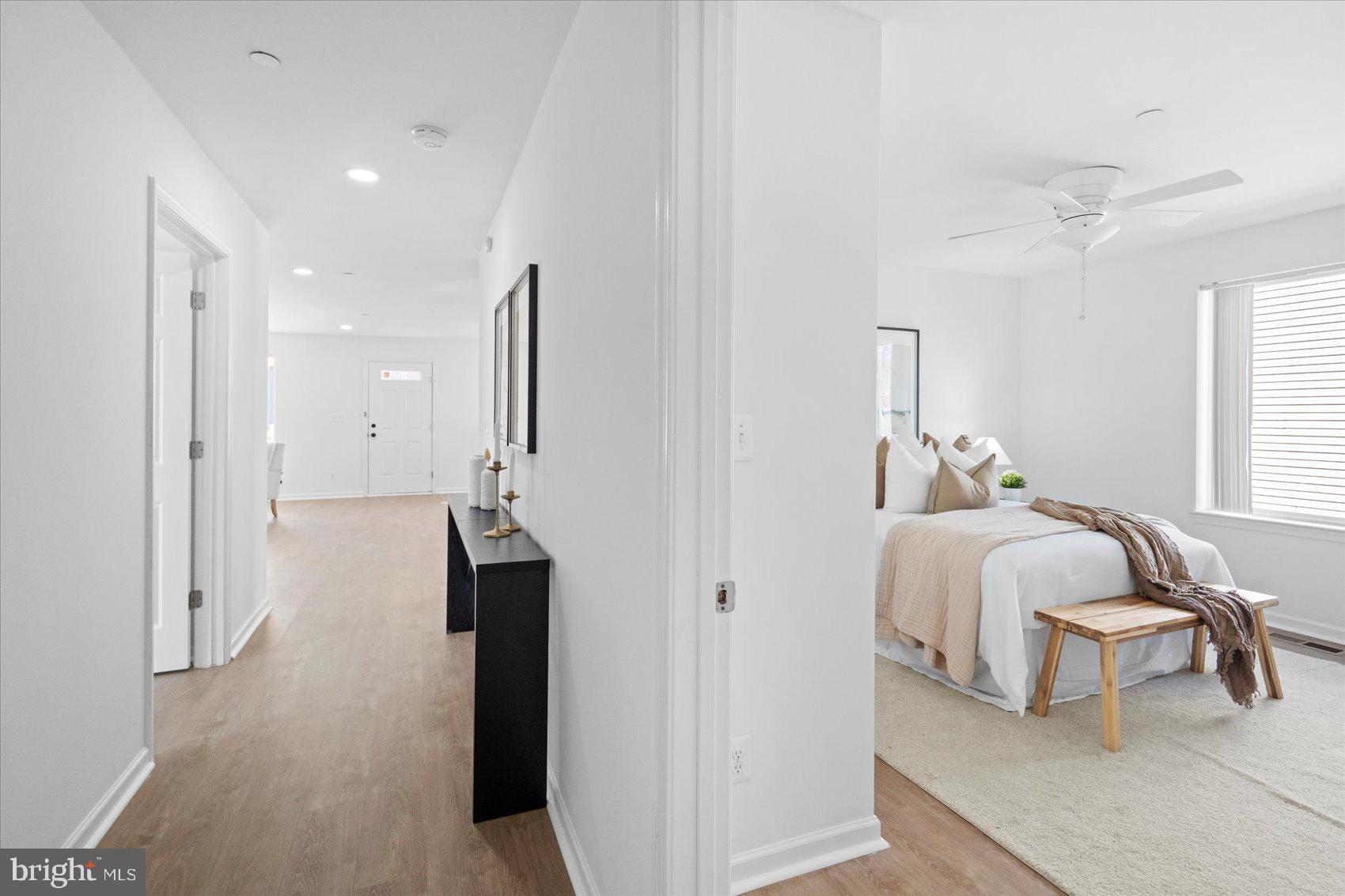 313 Homberg Avenue Baltimore, MD 21221 - Photo 31 of 47 a bed room with a bed and a chandelier