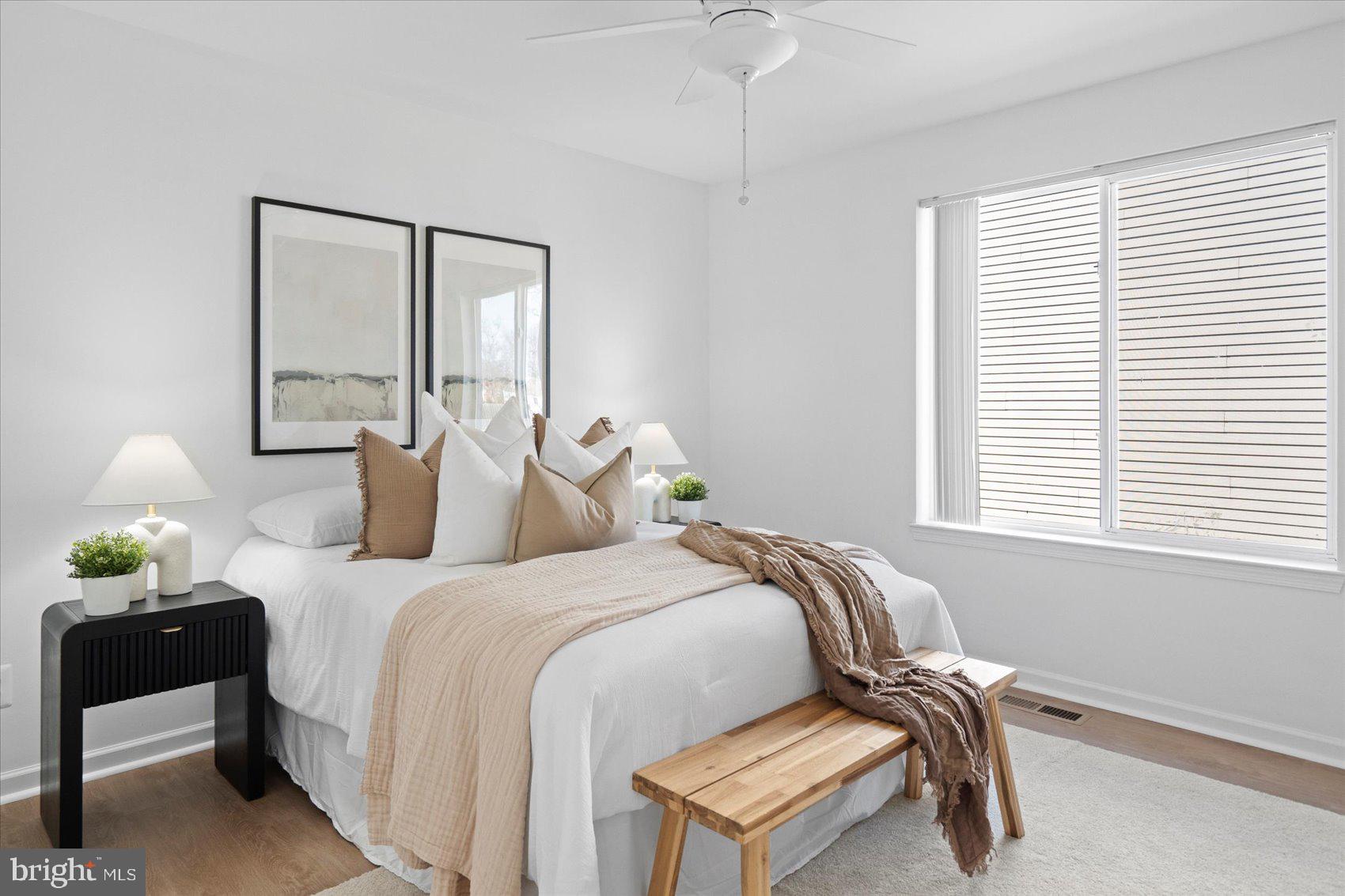 313 Homberg Avenue Baltimore, MD 21221 - Photo 32 of 47 a bedroom with two beds and a window