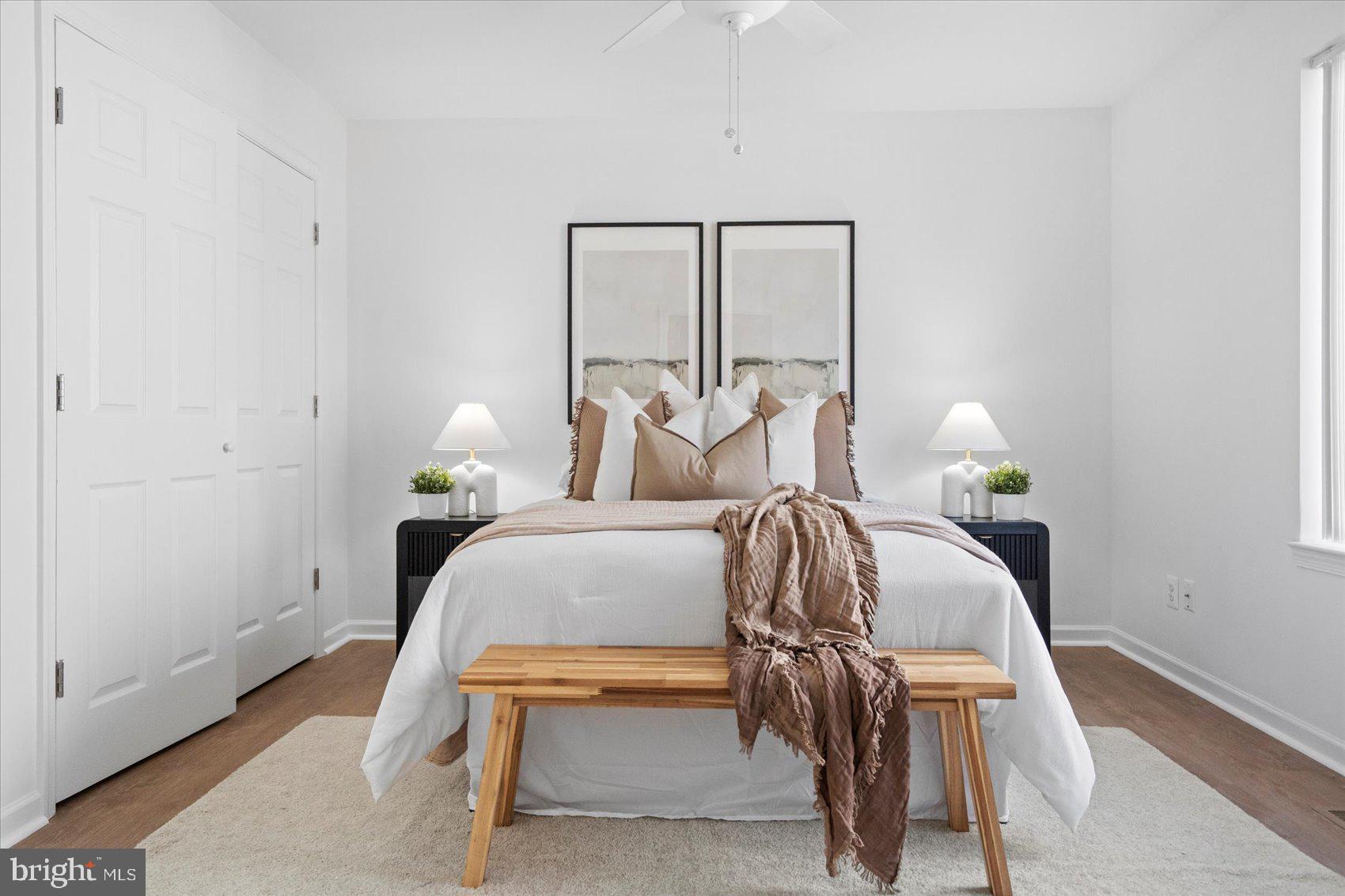 313 Homberg Avenue Baltimore, MD 21221 - Photo 33 of 47 a bedroom with a bed and wooden floor