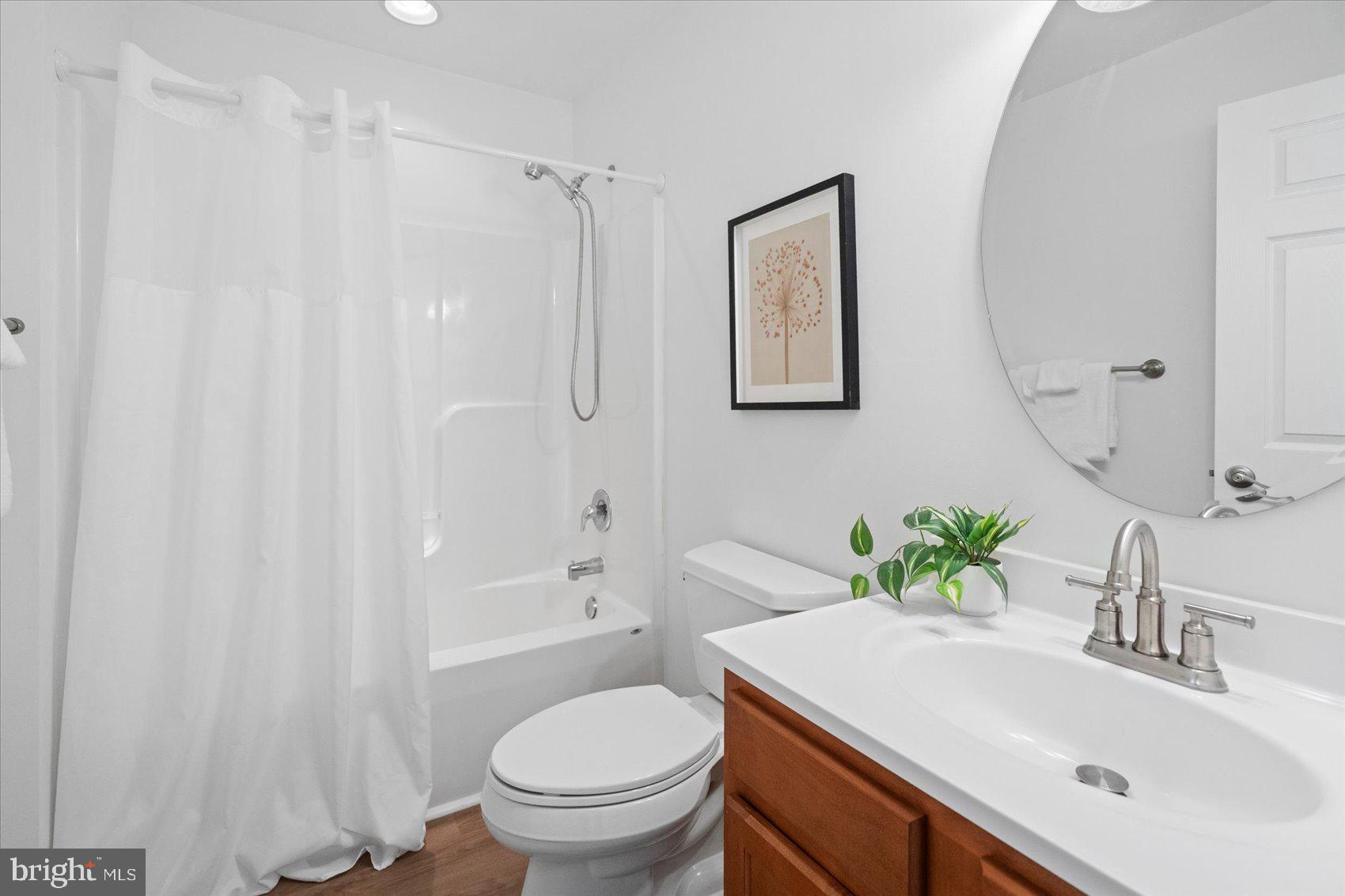 313 Homberg Avenue Baltimore, MD 21221 - Photo 39 of 47 a bathroom with a sink toilet and shower